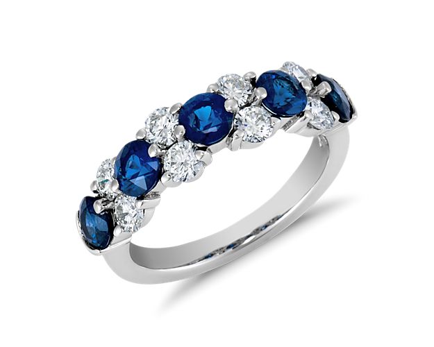 Delicate in design, elegant in form, this masterfully crafted sapphire and diamond ring features  brilliant round diamonds fashioned into a contemporary  garland design.  To prevent damage to the exposed diamonds, we recommend wearing this ring alone.