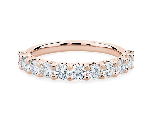 A classic beauty, this gorgeous 14k rose gold diamond ring showcases a sparkling row of shared-prong set diamonds.