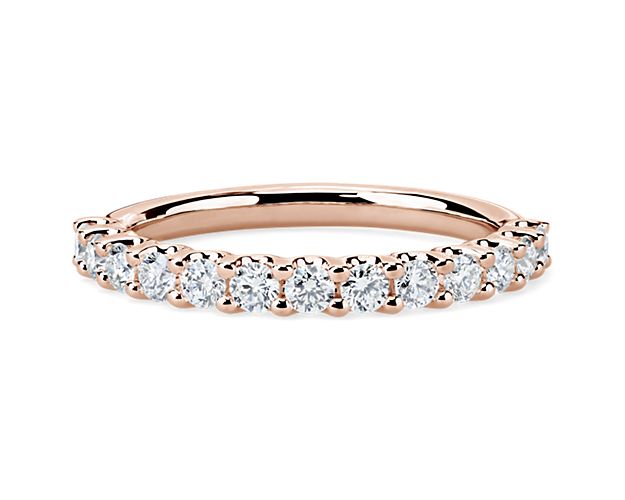 A classic beauty, this gorgeous 14k rose gold diamond ring showcases a sparkling row of shared-prong set diamonds.