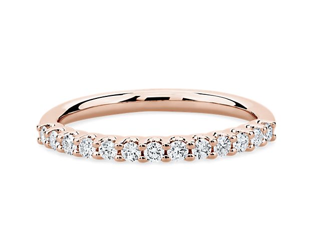 A classic beauty, this gorgeous 14k rose gold diamond ring showcases a sparkling row of shared-prong set diamonds.