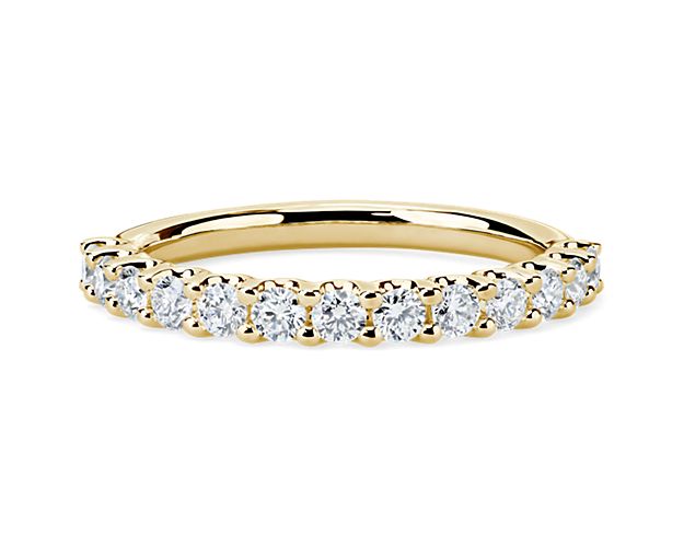 A classic beauty, this gorgeous 14k yellow gold diamond ring showcases a sparkling row of shared-prong set diamonds.