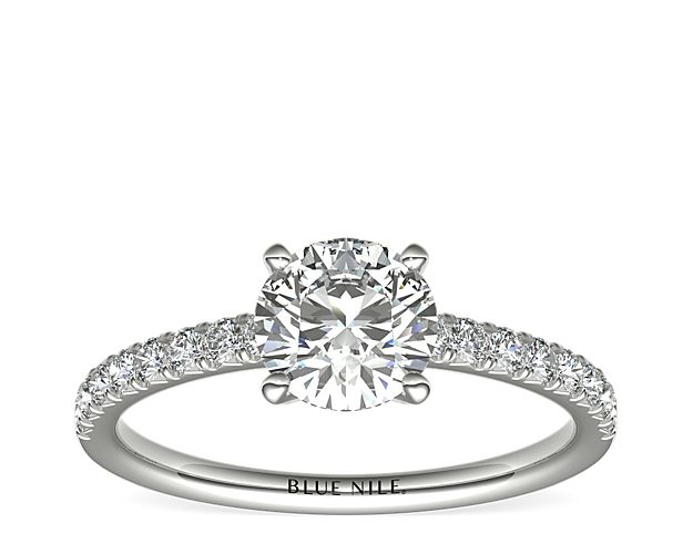 Eyes will be fixated on this immaculate platinum diamond engagement ring, showcasing French pavé-set diamonds that complement your choice of center diamond.