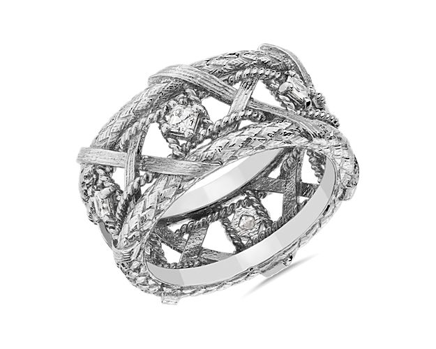 The intricately entwining woven basket design of this eternity ring is elegantly crafted in lustrous 18k white gold. It is beautifully set with sparkling diamonds for a luxurious finish.