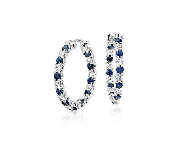 Add the striking contrast of these Luna sapphire and diamond hoop earrings to your collection. Petite deep blue round sapphire gemstones alternate with brilliant diamonds to create an everlasting circle of sparkle and color set in classic 18k white gold. These hoops are a great size for everyday wear.