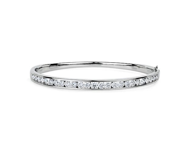 Add gorgeous gleam to your wrist with this round bangle bracelet crafted from bright 14k white gold. Brilliant lab-grown diamonds encircle the bracelet, adding sparkling luxury.