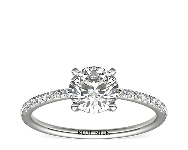 Delicate and beautiful, this diamond engagement ring in platinum features a half circle of sparkling petite micropavé diamonds to complement your center diamond.