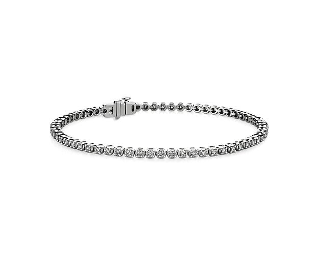 Simple and brilliant, this classic tennis bracelet features round, brilliant lab-grown diamonds framed in 14k white gold.