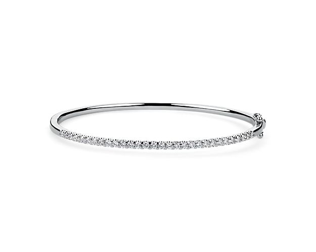 Add a dash of sparkle to your wrist with this stunning bangle crafted in gleaming 14k white gold. The front edge is lined with a shimmering 1 ct. tw. in gorgeously brilliant diamonds.