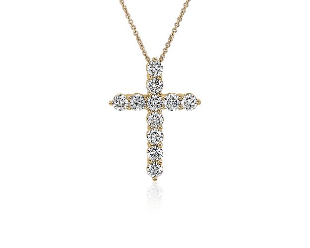 Gorgeous lab grown diamonds sparkle along the arms of this elegant cross necklace, adding bold sparkle to your style. It is crafted in 14k yellow gold that promises a cool lustre and luxurious quality.