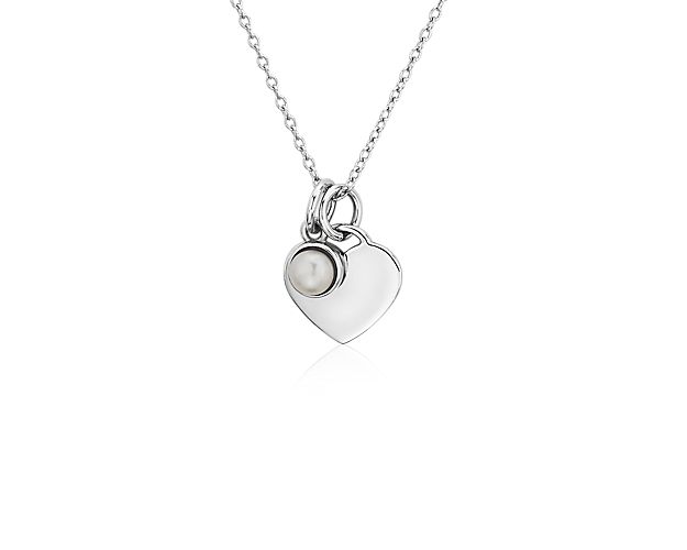 A lustrous, bezel-set white pearl comes paired with a polished sterling silver heart in this pretty pendant. The delicate charms are strung on a classic cable chain that can fasten at either 16 or 18 inches, making it a perfect layering piece.