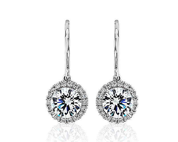 These elegant platinum earring settings will compliment the brilliance of your choice of round diamonds. Each earring is French pavé-set with round diamonds around the setting.