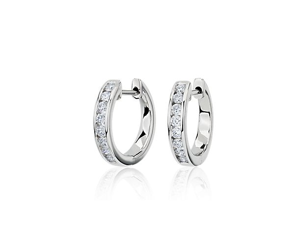 Sparkle as you catch the light wearing these eternity hoops set with brilliant lab-grown diamonds. They feature timeless design in lustrous 14k white gold that promises lasting luxury.