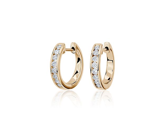 Sparkle as you catch the light wearing these eternity hoops set with brilliant lab-grown diamonds. They feature timeless design in lustrous 14k white gold that promises lasting luxury.