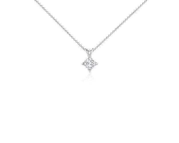 A near-colorless princess cut diamond is secured at the corners by 18k white gold prongs. An 18k white gold bail suspends the pendant from an 18k white gold cable-link chain. 1.5 carat total diamond weight. Accompanied by either a GIA or GCAL diamond grading report.