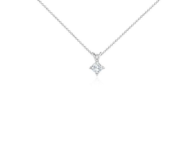 A near-colorless princess cut diamond is secured at the corners by 18k white gold prongs. An 18k white gold bail suspends the pendant from an 18k white gold cable-link chain. 3/4 carat total diamond weight.