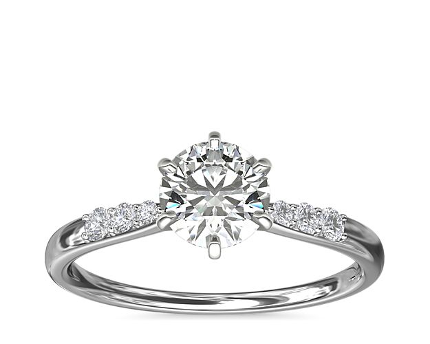 Complement your center diamond perfectly with this platinum engagement ring accented with pavé-set diamonds along the shank.