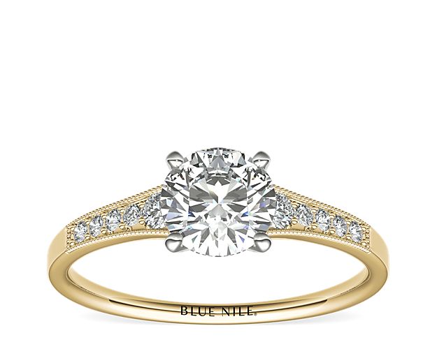 Ideal for any center diamond of your choice, this 14k yellow gold engagement ring showcases a diamond accent along the shank and milgrain detailing.