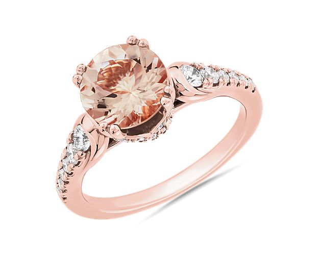 Capture dreamy romance with this ring boasting a pink morganite stone set in 14k rose gold. Shimmering accent diamonds sparkle as they trail along the sides of the shaft.