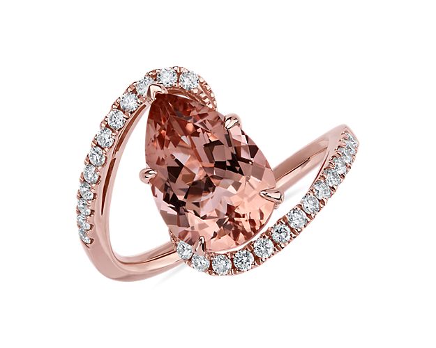 Capture their attention when you wear this statement ring featuring a pear-cut morganite stone at the heart of the gracefully twisting 14k rose gold band. Shimmering diamonds add sparkle along the band's curves.