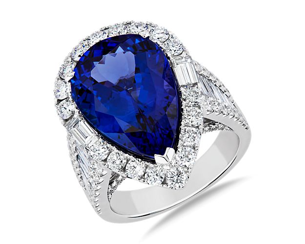 Set in 18k white gold, this ring features a stunning pear shaped tanzanite surrounded by a diamond halo for extra sparkle. Diamonds along the band offer a shine no matter which way you look at it.