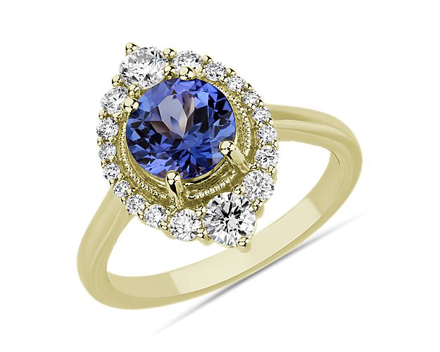 A dreamy violet tanzanite stone nestles at the heart of this ring, summoning attention with its dramatic hue. Accent diamonds frame the eye-shaped setting, giving it beautifully intriguing style with plenty of shimmer.