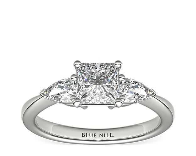 Exceptionally crafted, this diamond engagement ring showcases two beautifully matched pear-shaped diamonds prong-set in platinum to frame your center diamond. Diamonds equal 1/2 carat total weight.