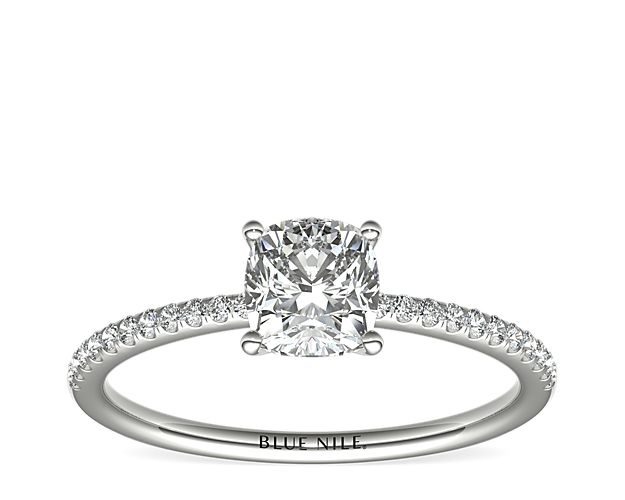 Delicate and beautiful, this diamond engagement ring in platinum features a half circle of sparkling petite micropavé diamonds to complement your center diamond.