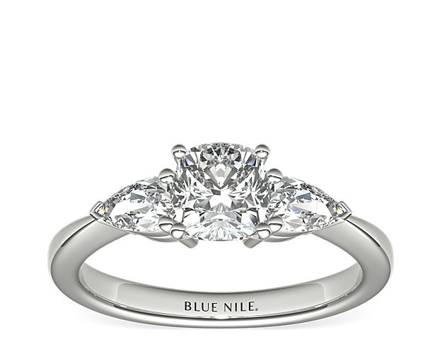 Exceptionally crafted, this diamond engagement ring showcases two beautifully matched pear-shaped diamonds prong-set in platinum to frame your center diamond. Diamonds equal 1/2 carat total weight.