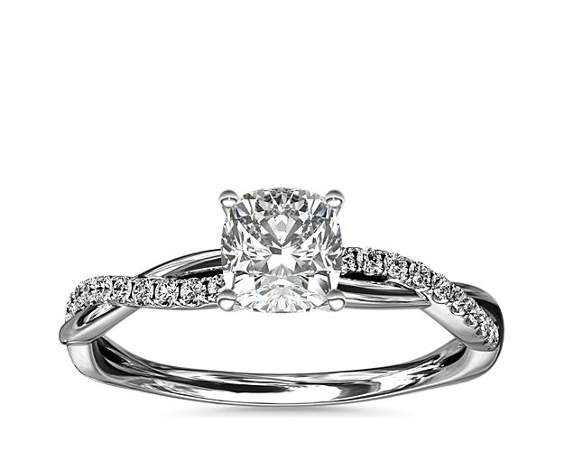 Classic with a twist, this 14k white gold engagement ring features a delicate twist of pavé-set diamonds that will complement the center diamond of your choice.