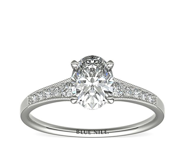 Ideal for any center diamond of your choice, this platinum engagement ring showcases a diamond accent along the shank and milgrain detailing.