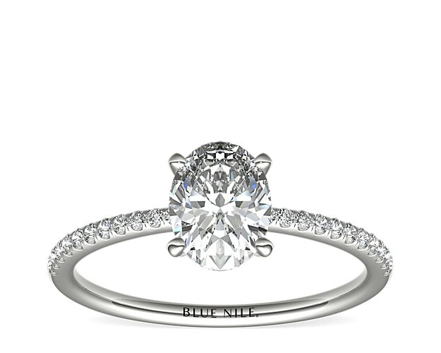 Delicate and beautiful, this diamond engagement ring in platinum features a half circle of sparkling petite micropavé diamonds to complement your center diamond.