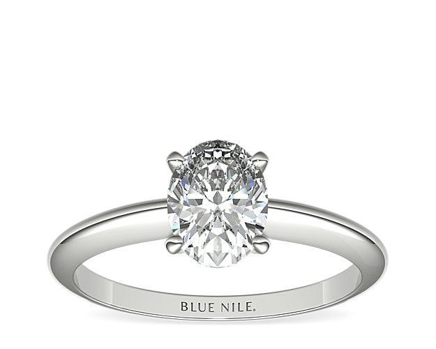 Let your diamond shine brilliantly in this classic platinum four-prong solitaire engagement ring. The slim silhouette and polished finish exemplify timeless style. Select from a variety of diamond shapes to create the perfect classic solitaire engagement ring for you.