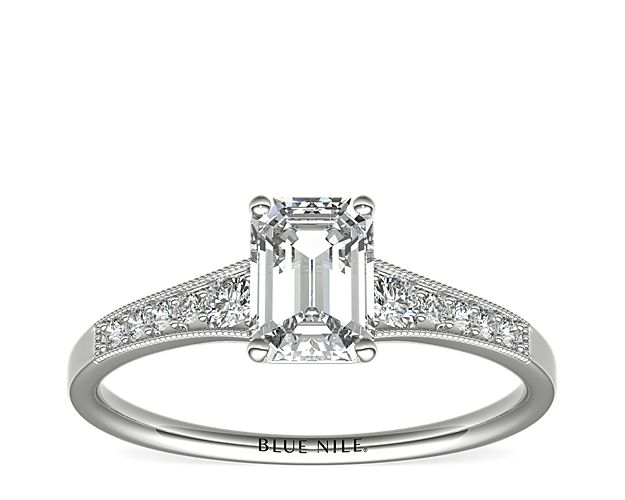 Ideal for any center diamond of your choice, this platinum engagement ring showcases a diamond accent along the shank and milgrain detailing.