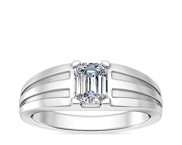 Love shines brilliantly from this engagement ring featuring an elegant center setting that  supports princess (prince), emerald-cut, and radiant-cut diamonds. The lustrous platinum design features beautifully tapered and grooved stylings along the band.