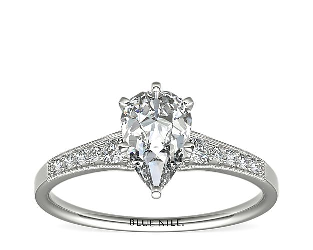 Ideal for any center diamond of your choice, this platinum engagement ring showcases a diamond accent along the shank and milgrain detailing.