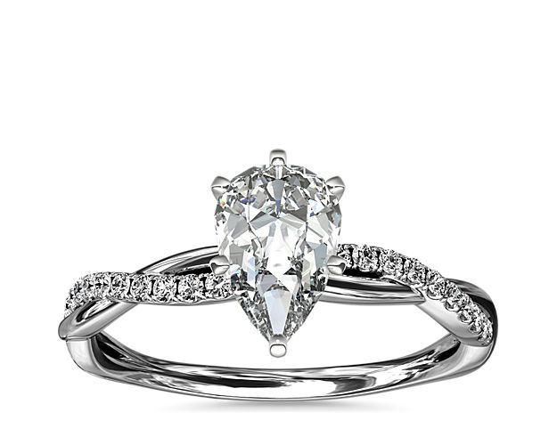 Classic with a twist, this 14k white gold engagement ring features a delicate twist of pavé-set diamonds that will complement the center diamond of your choice.