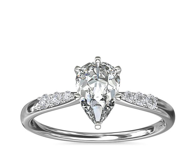 Complement your center diamond perfectly with this platinum engagement ring accented with pavé-set diamonds along the shank.