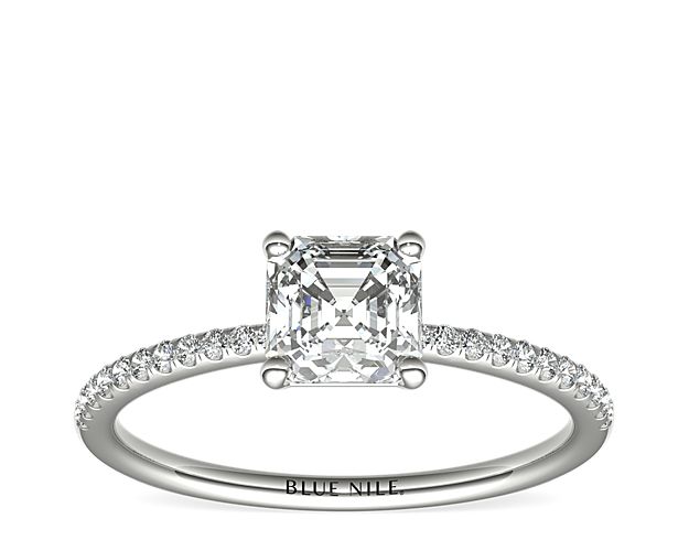 Delicate and beautiful, this diamond engagement ring in platinum features a half circle of sparkling petite micropavé diamonds to complement your center diamond.