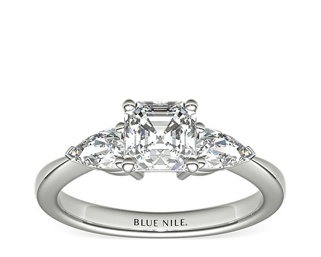 Exceptionally crafted, this diamond engagement ring showcases two beautifully matched pear-shaped diamonds prong-set in platinum to frame your center diamond. Diamonds equal 1/2 carat total weight.