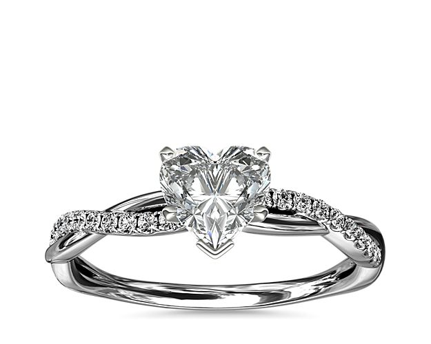 Classic with a twist, this 14k white gold engagement ring features a delicate twist of pavé-set diamonds that will complement the center diamond of your choice.