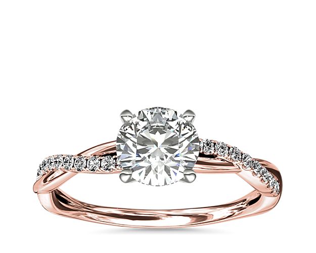 Classic with a twist, this 14k rose gold engagement ring features a delicate twist of pavé-set diamonds that will complement the center diamond of your choice.