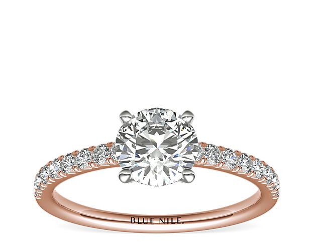 With the perfect hint of pink, this engagement ring showcases French pavé-set diamonds set in 14k rose gold that complement your choice of center diamond.