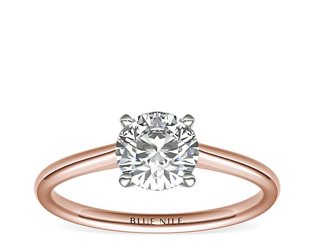 Elegant in its simplicity, this petite solitaire crafted in 14k rose gold is a beautifully classic frame for your choice of center diamond.