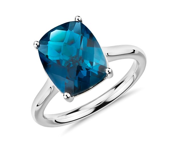 London blue topaz makes a bold statement in this fashion-forward gemstone ring crafted of 14k white gold.