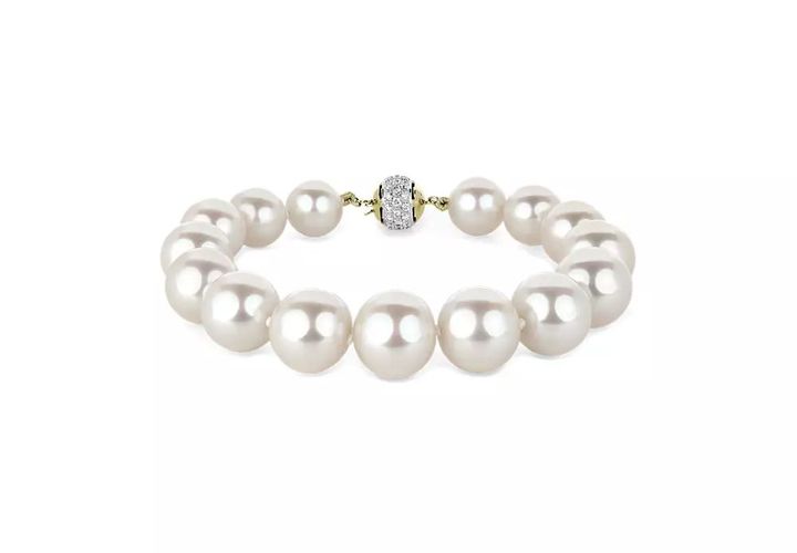 A June birthstone bracelet of woven freshwater pearls woven together and clasped in white gold