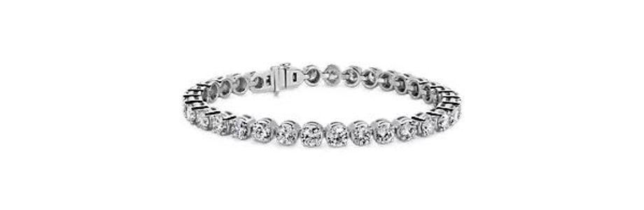 White gold tennis bracelet featuring lab grown diamonds.